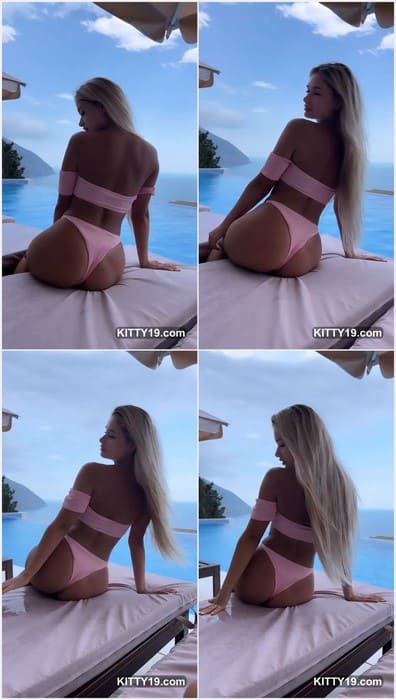 Alinaaignatova boobs is posture is relaxed yet statuesque, blonde locks resting over her shoulders and a shapely figure in subtle focus.