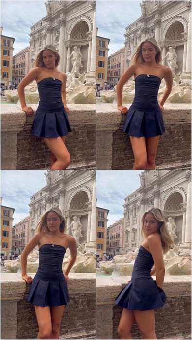 Olivia Ponton ass poses in Rome by the Trevi Fountain, showcasing elegance and poise in a chic strapless navy dress.